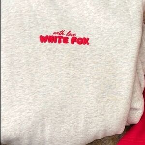 White Fox Boutique grey sweatshirt with Red Logo